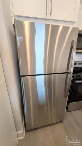 a stove top oven sitting inside of a kitchen