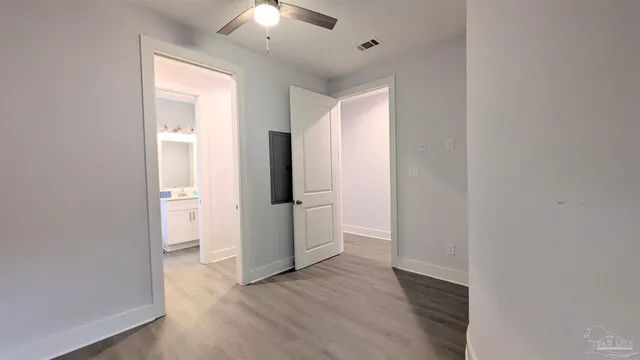 a view of an entryway with wooden floor