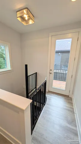 a kitchen with a table chairs refrigerator and microwave