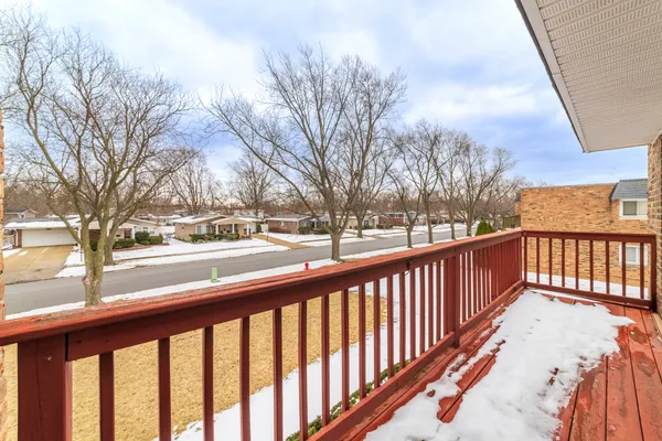 a view of a balcony with snow