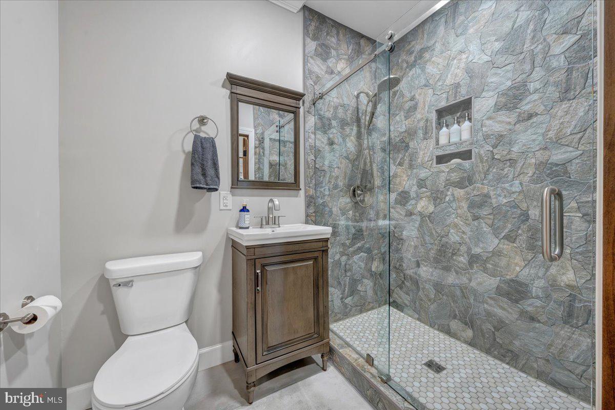 415 Grahams Farm Road Stuart, VA 24171 - Photo 47 of 121 Sleek modern bathroom with stone accents.