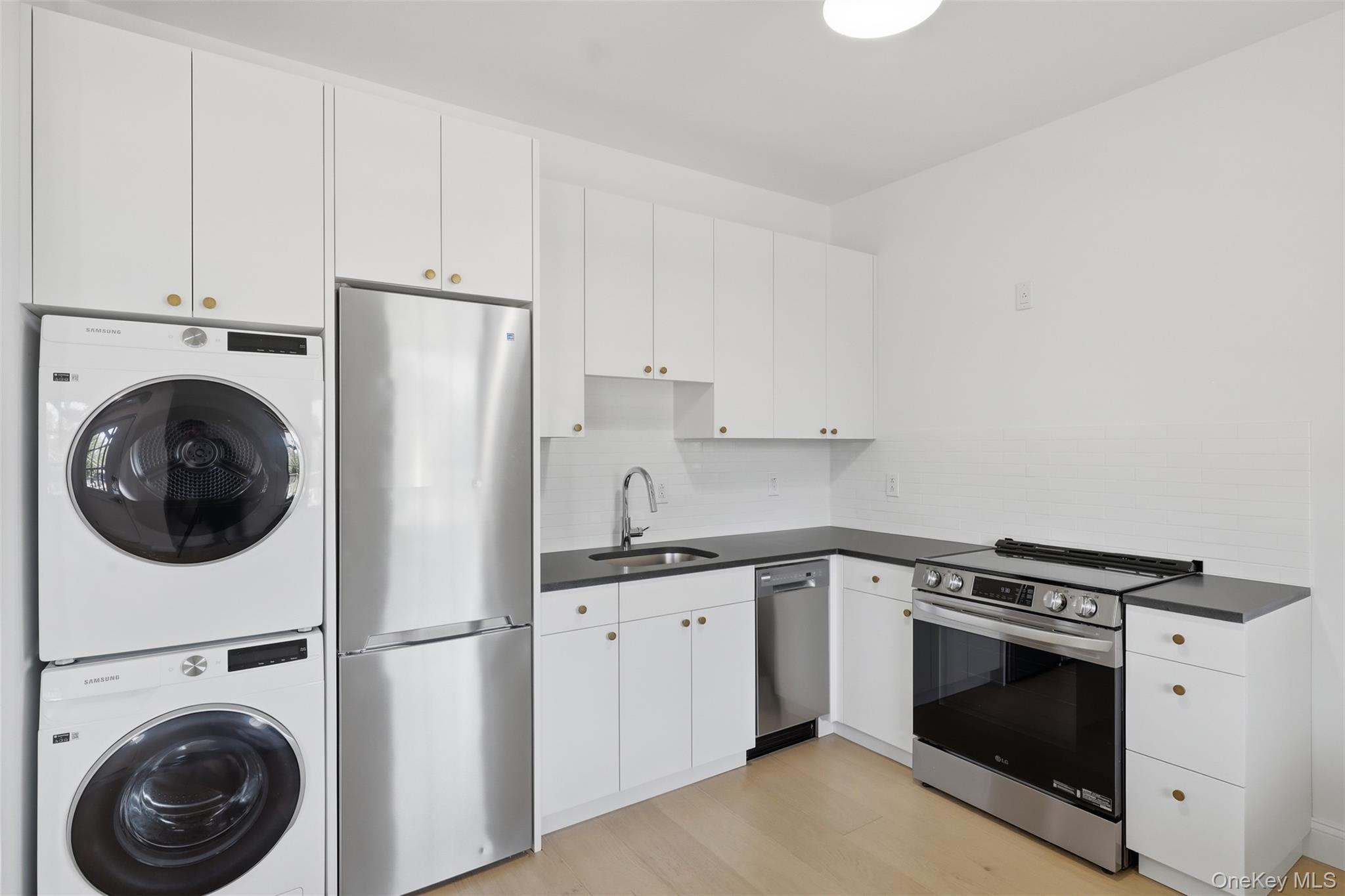 201 Main Street, Unit 2 Beacon, NY 12508 - Photo 11 of 24 Kitchen with brand new appliances and private laundry