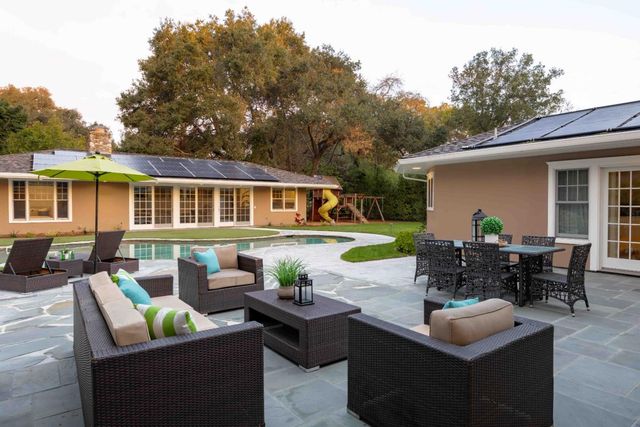 a view of house with outdoor seating space