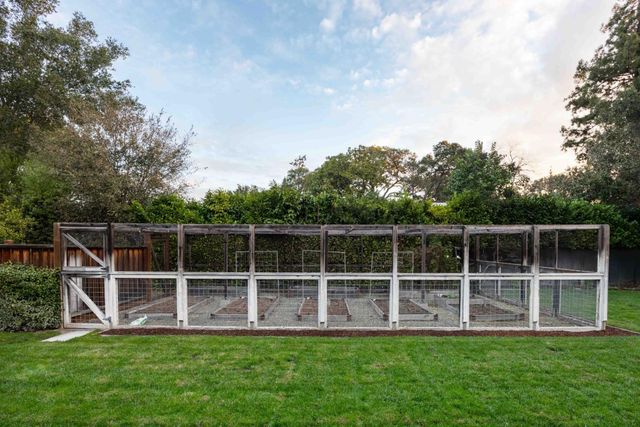 a yard with wooden fence