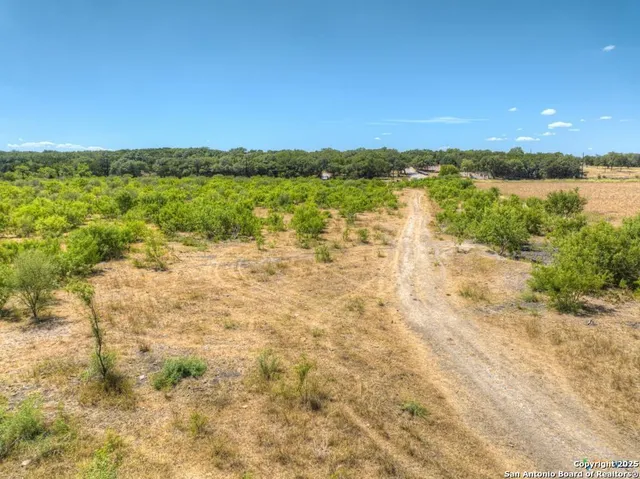 a view of a lake with a yard
