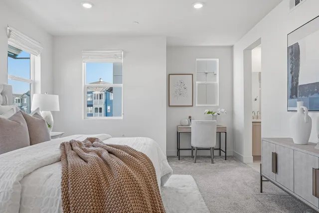 a bedroom with a bed and furniture