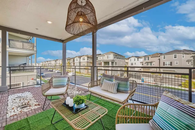 a view of balcony with furniture