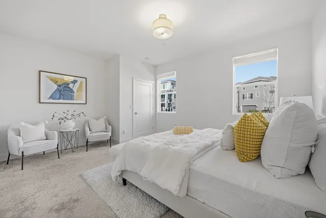 a bedroom with a bed and a couch