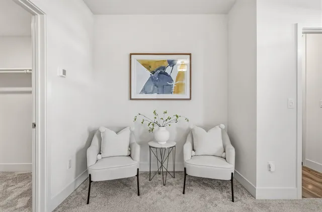 a view of a hallway with chairs