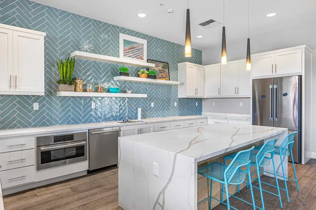 a view of a house with entrance door and garden