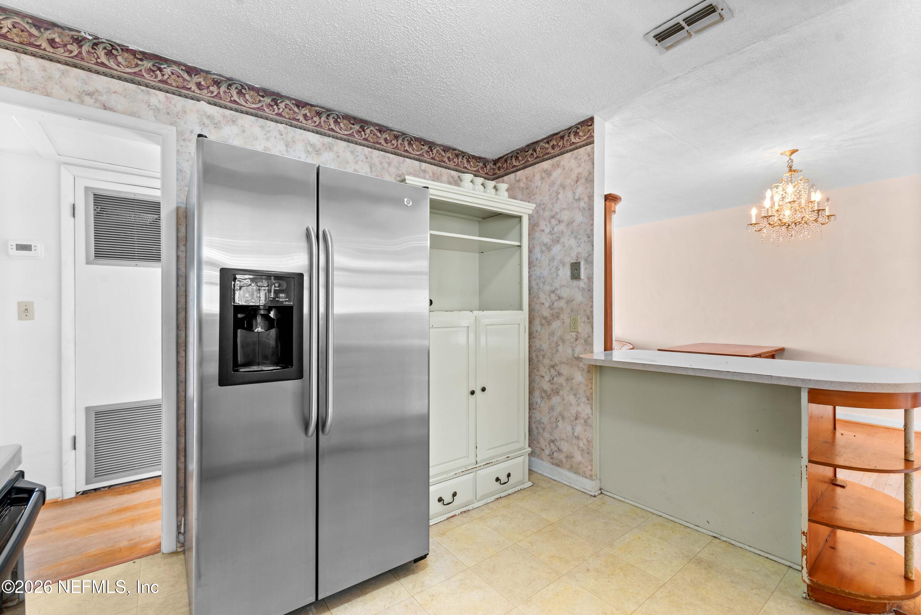 3905 Ferrarra Street Jacksonville, FL 32217 - Photo 11 of 29 a view of a living room with windows