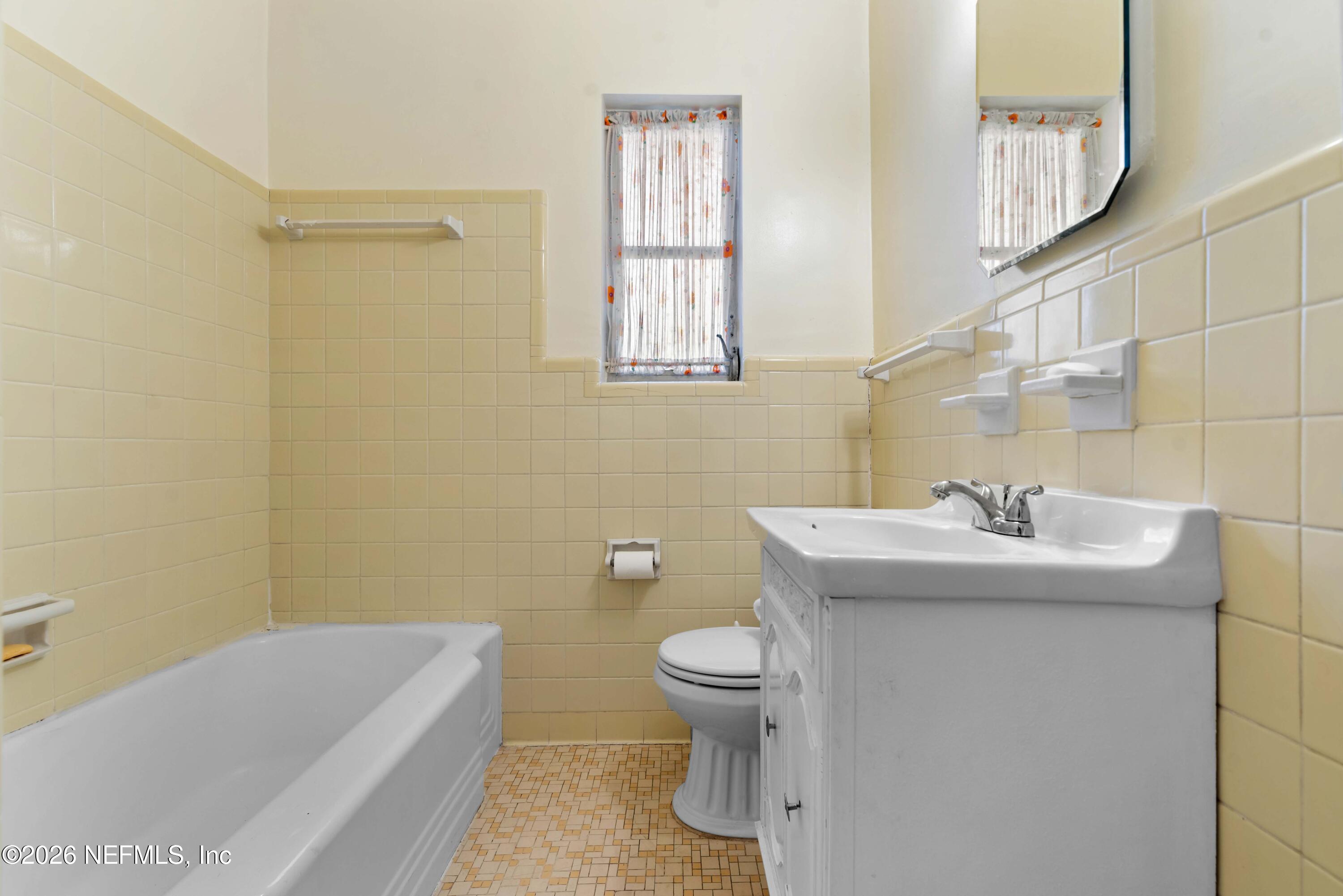 3905 Ferrarra Street Jacksonville, FL 32217 - Photo 16 of 29 a bathroom with a sink a toilet and shower