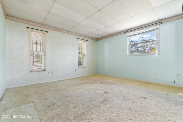 an empty room with windows