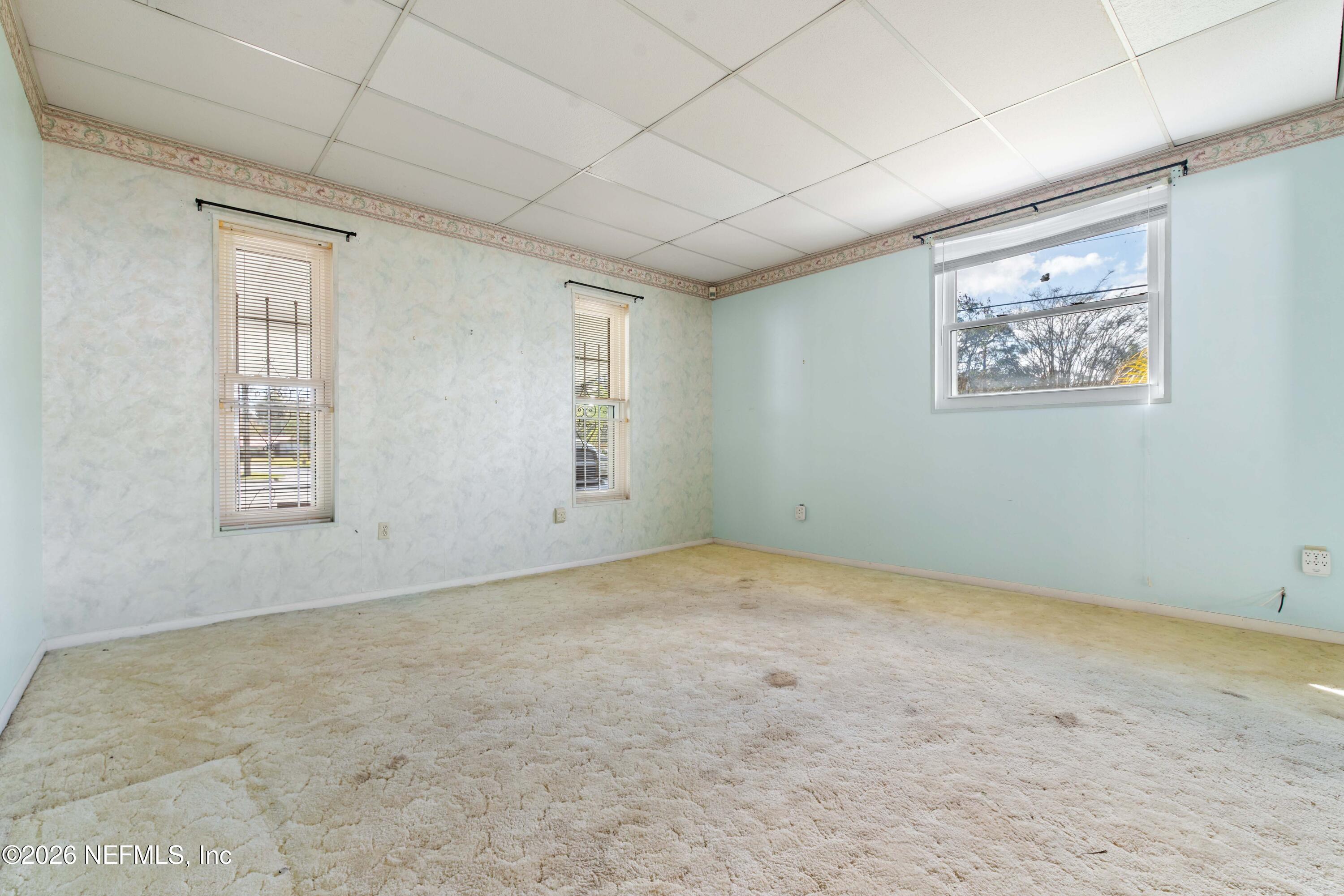 3905 Ferrarra Street Jacksonville, FL 32217 - Photo 17 of 29 an empty room with windows