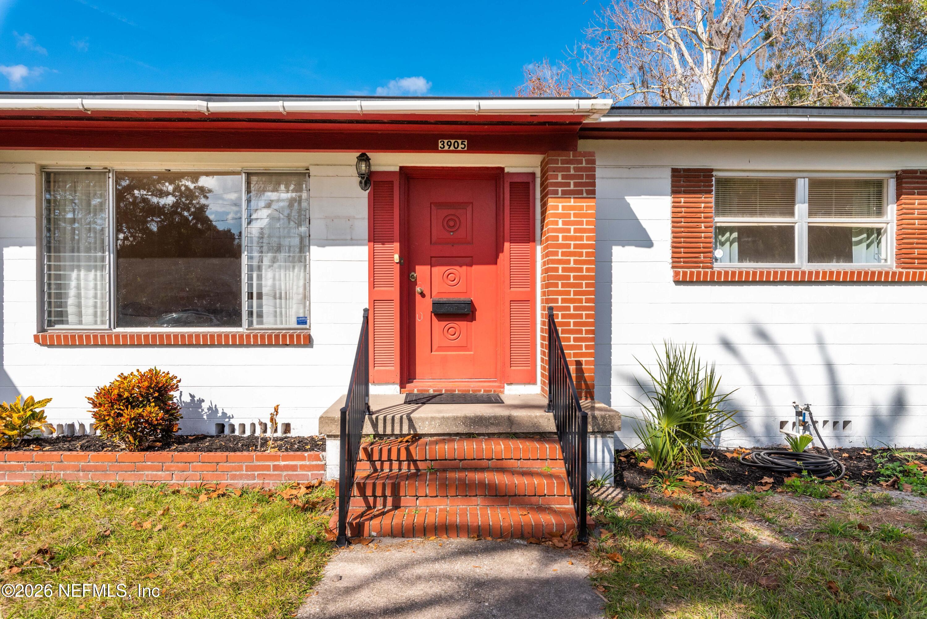 3905 Ferrarra Street Jacksonville, FL 32217 - Photo 2 of 29 a front view of a house with a yard