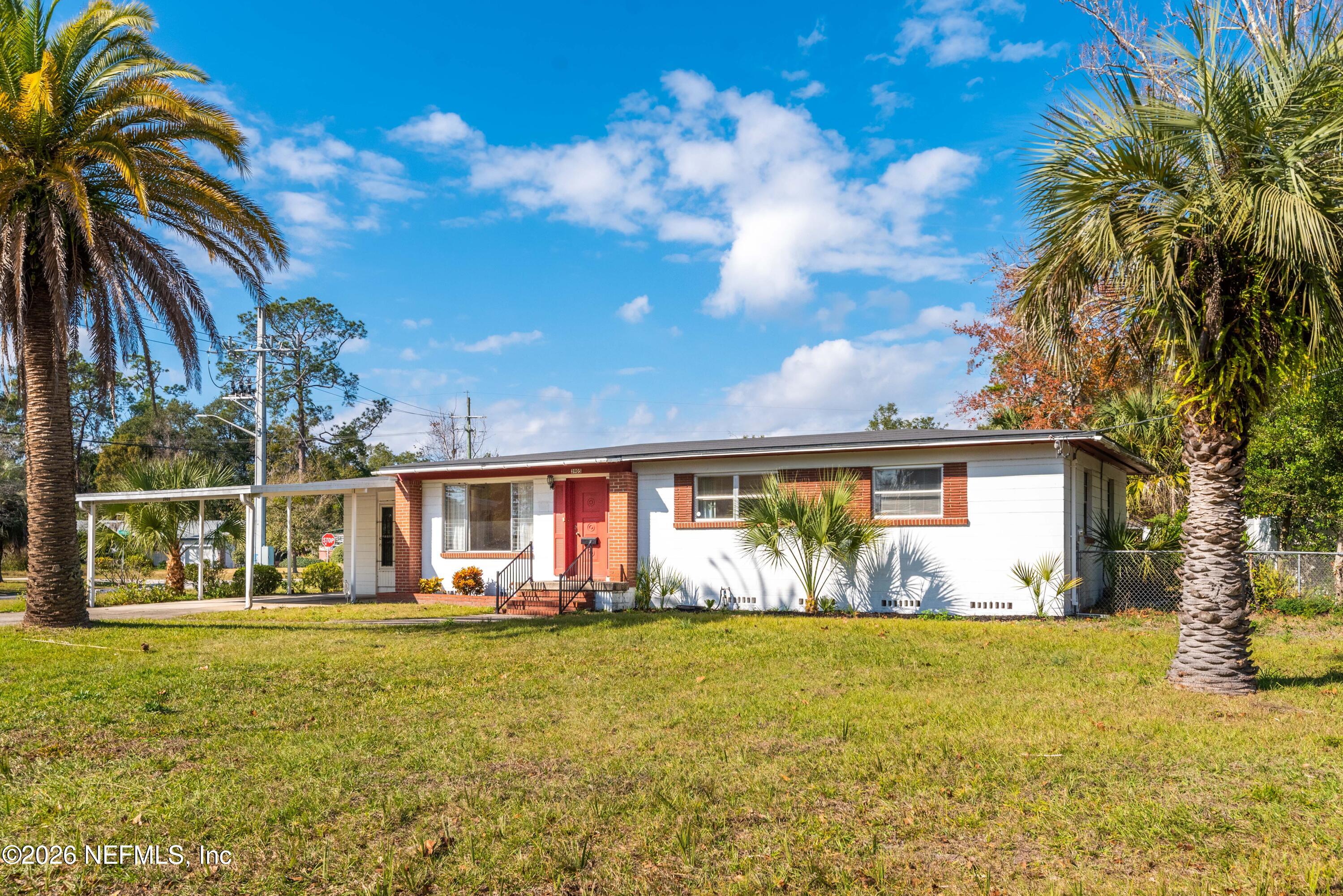 3905 Ferrarra Street Jacksonville, FL 32217 - Photo 24 of 29 a front view of house with yard and seating space