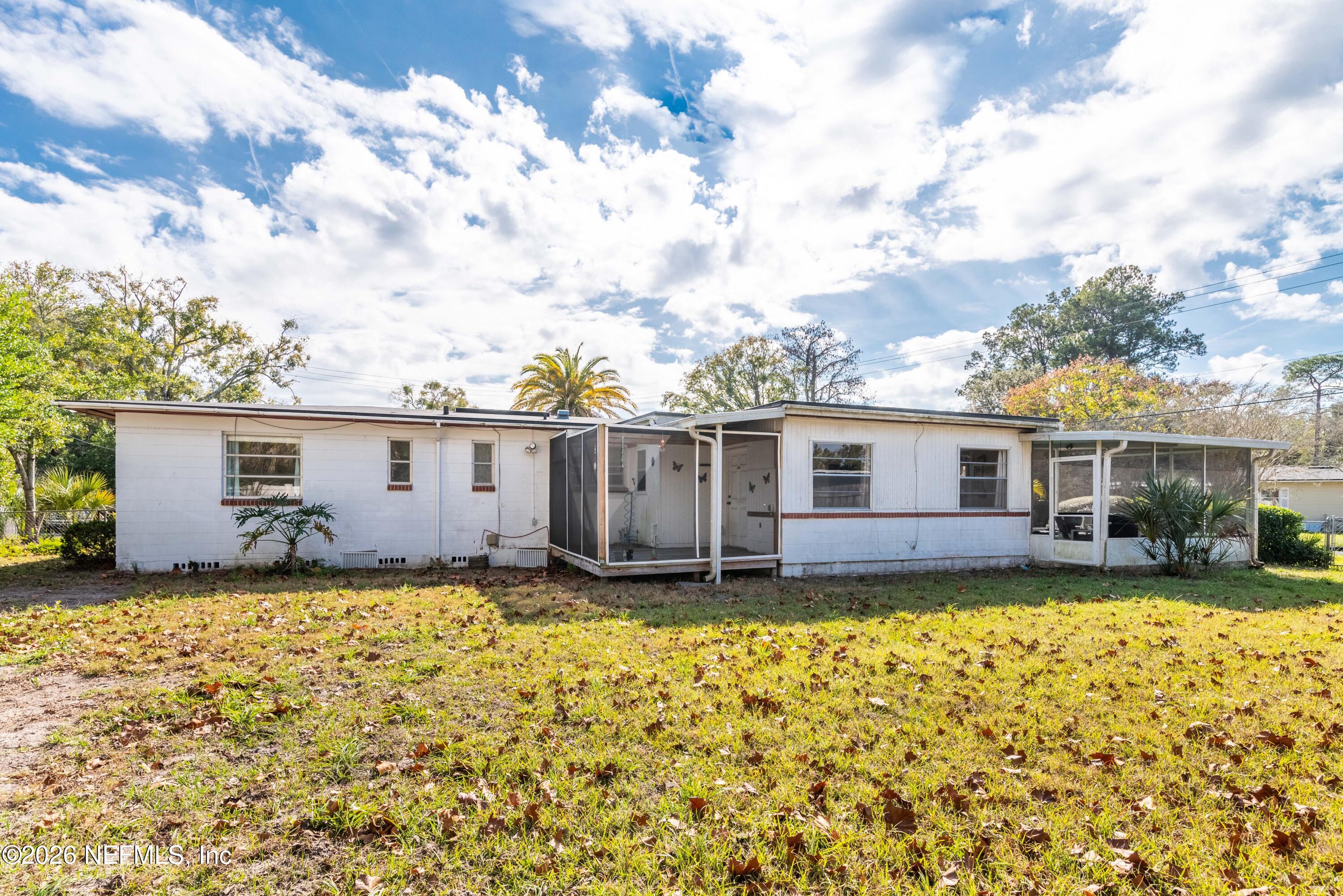 3905 Ferrarra Street Jacksonville, FL 32217 - Photo 28 of 29 a view of a house with a yard