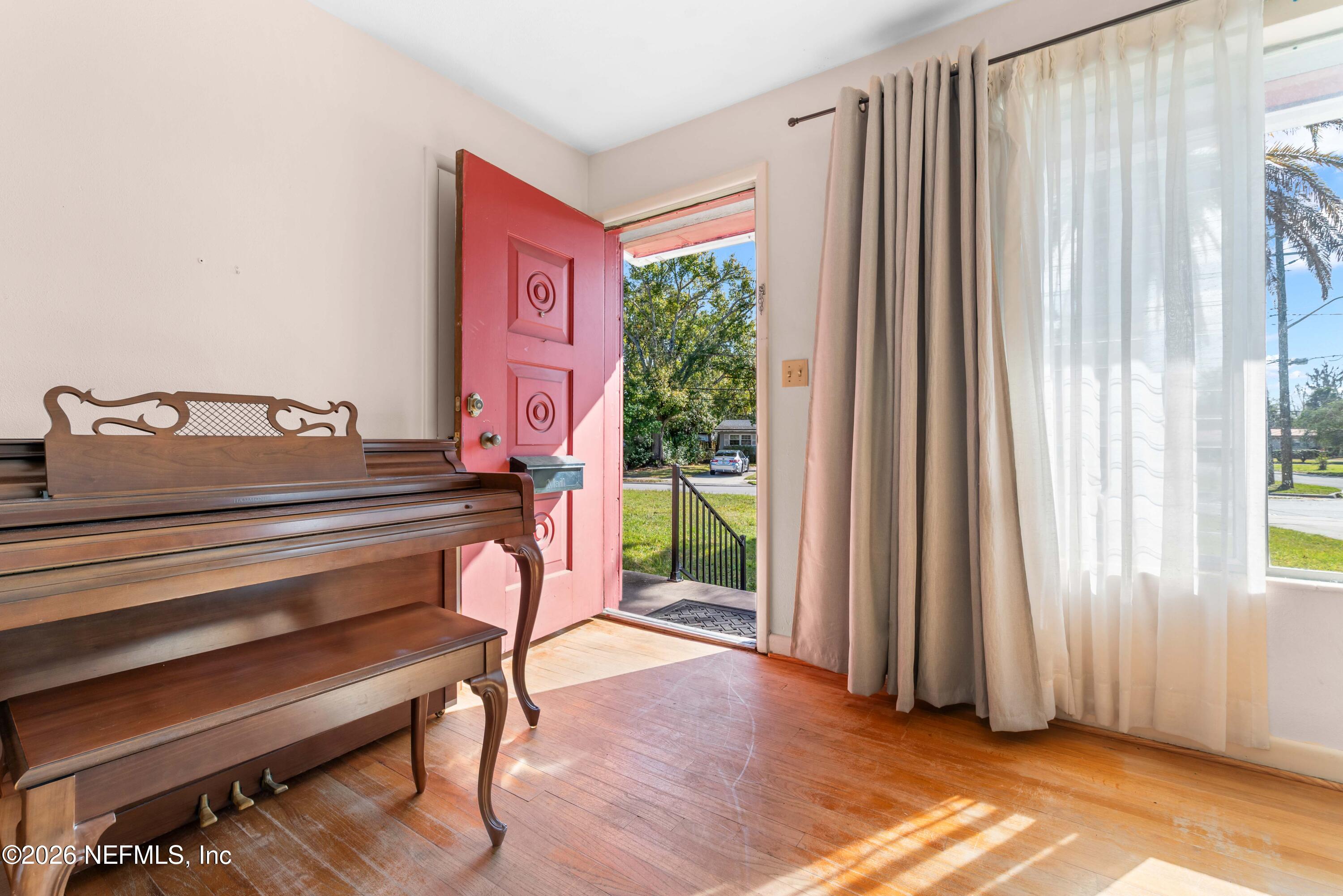 3905 Ferrarra Street Jacksonville, FL 32217 - Photo 3 of 29 a backyard of a house with outdoor seating