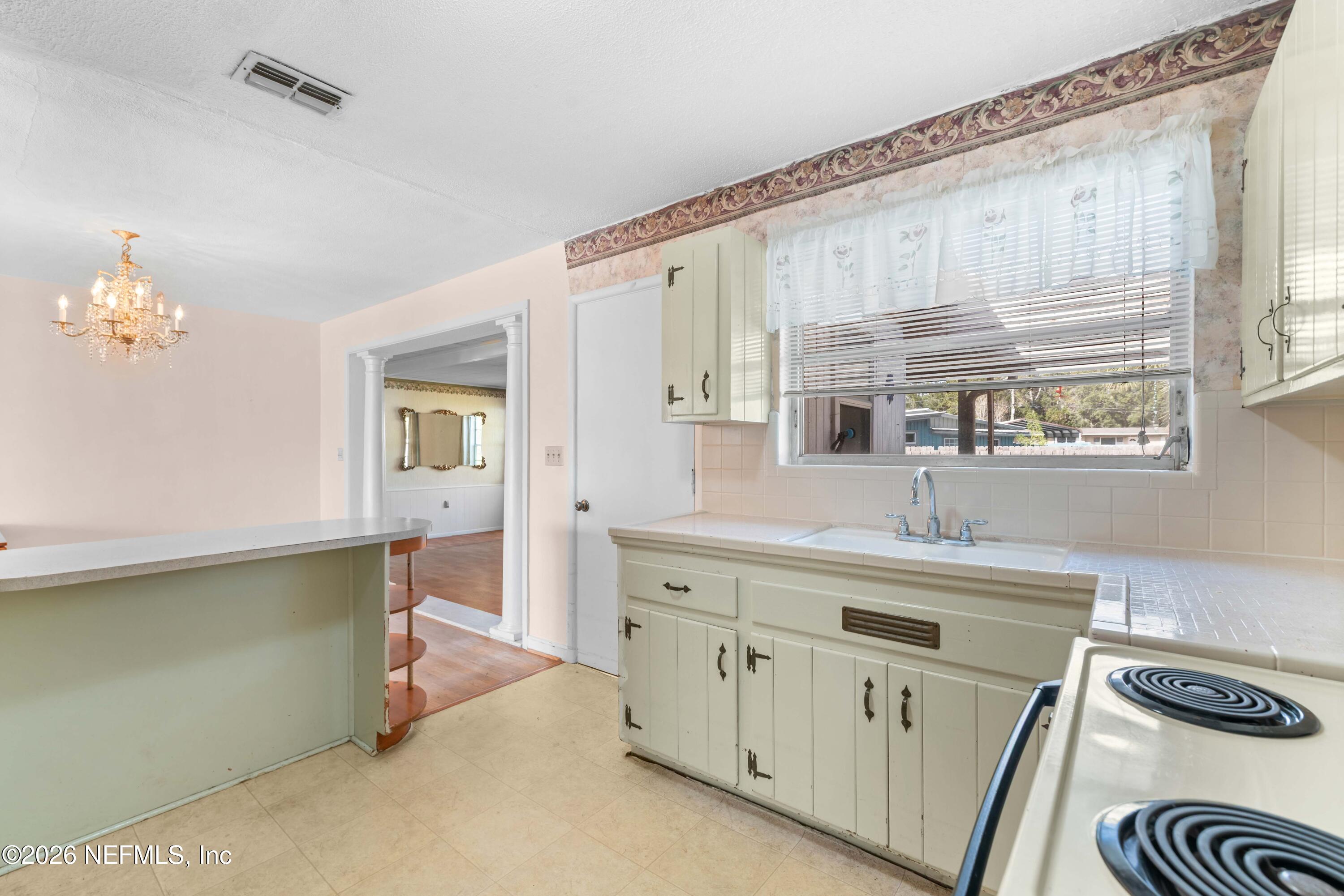 3905 Ferrarra Street Jacksonville, FL 32217 - Photo 9 of 29 a spacious bathroom with a sink double vanity and a mirror