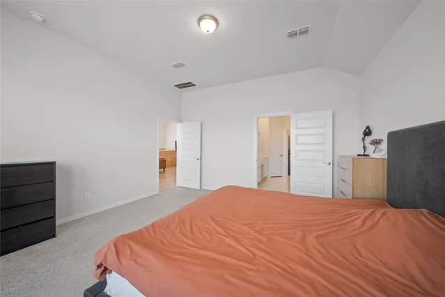 a bathroom with a granite countertop sink a mirror a bathtub and shower