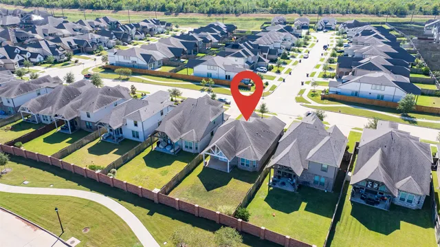 an aerial view of residential building and parking space