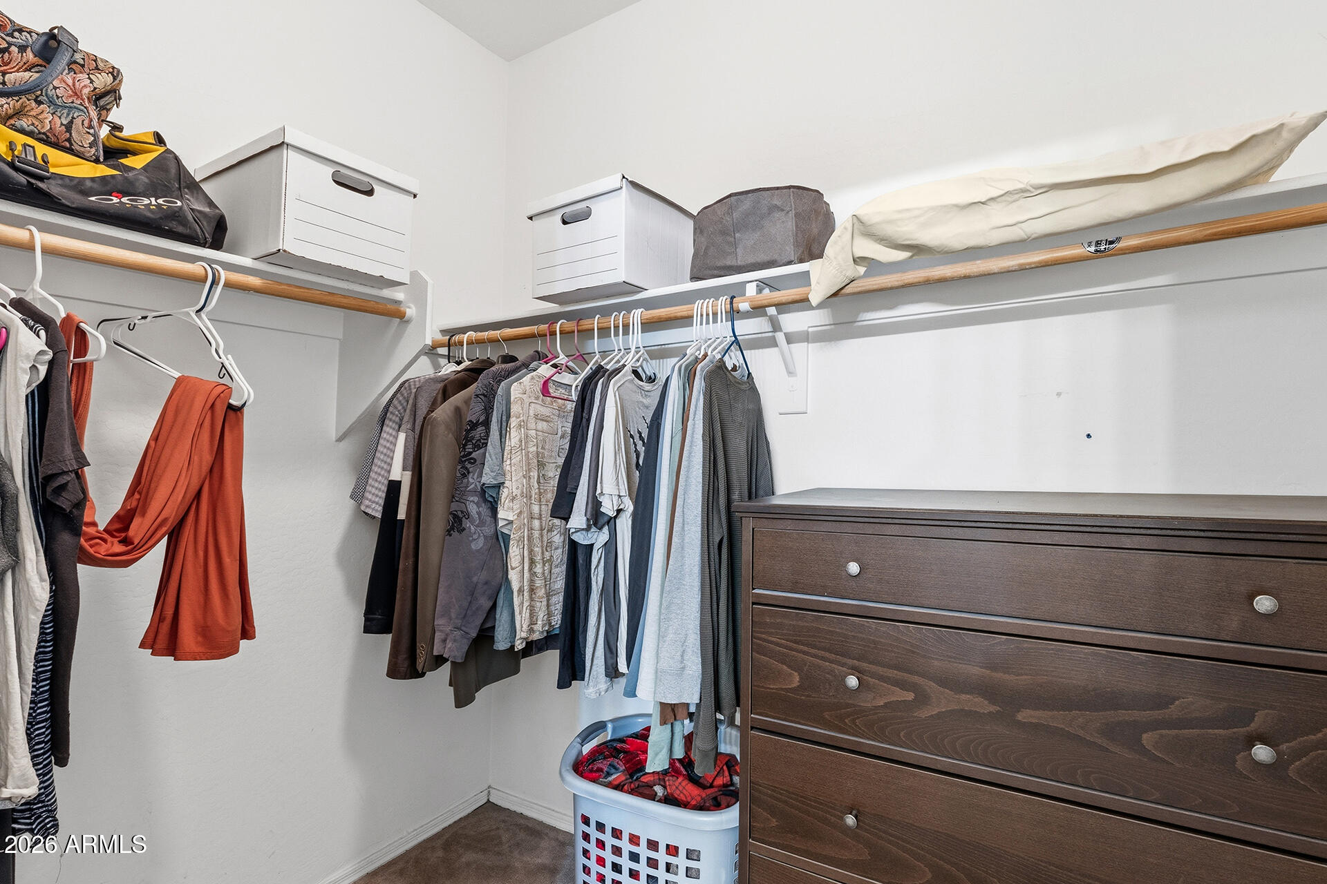 6718 West Darrel Road Laveen, AZ 85339 - Photo 8 of 49 a view of walk in closet with clothes and shoes