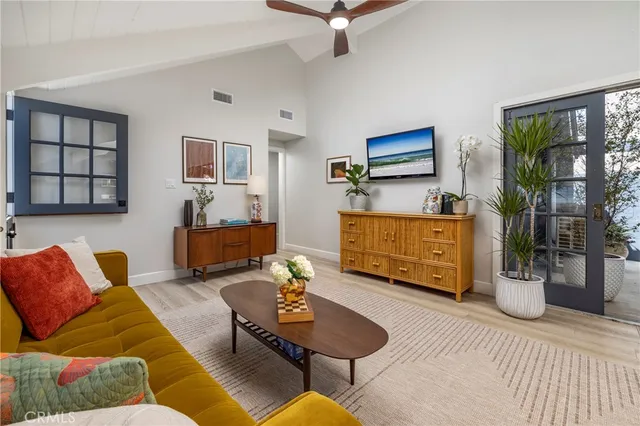 a view of a entryway door of the house and living room