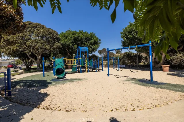 an aerial view of residential houses with outdoor space and lake view