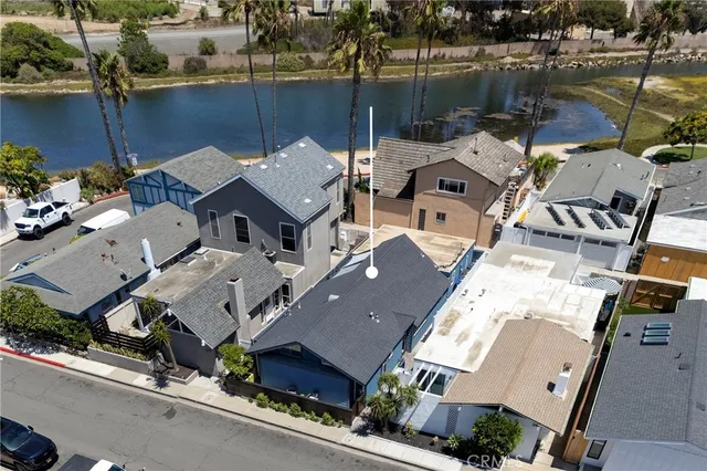 an aerial view of a house with a ocean view