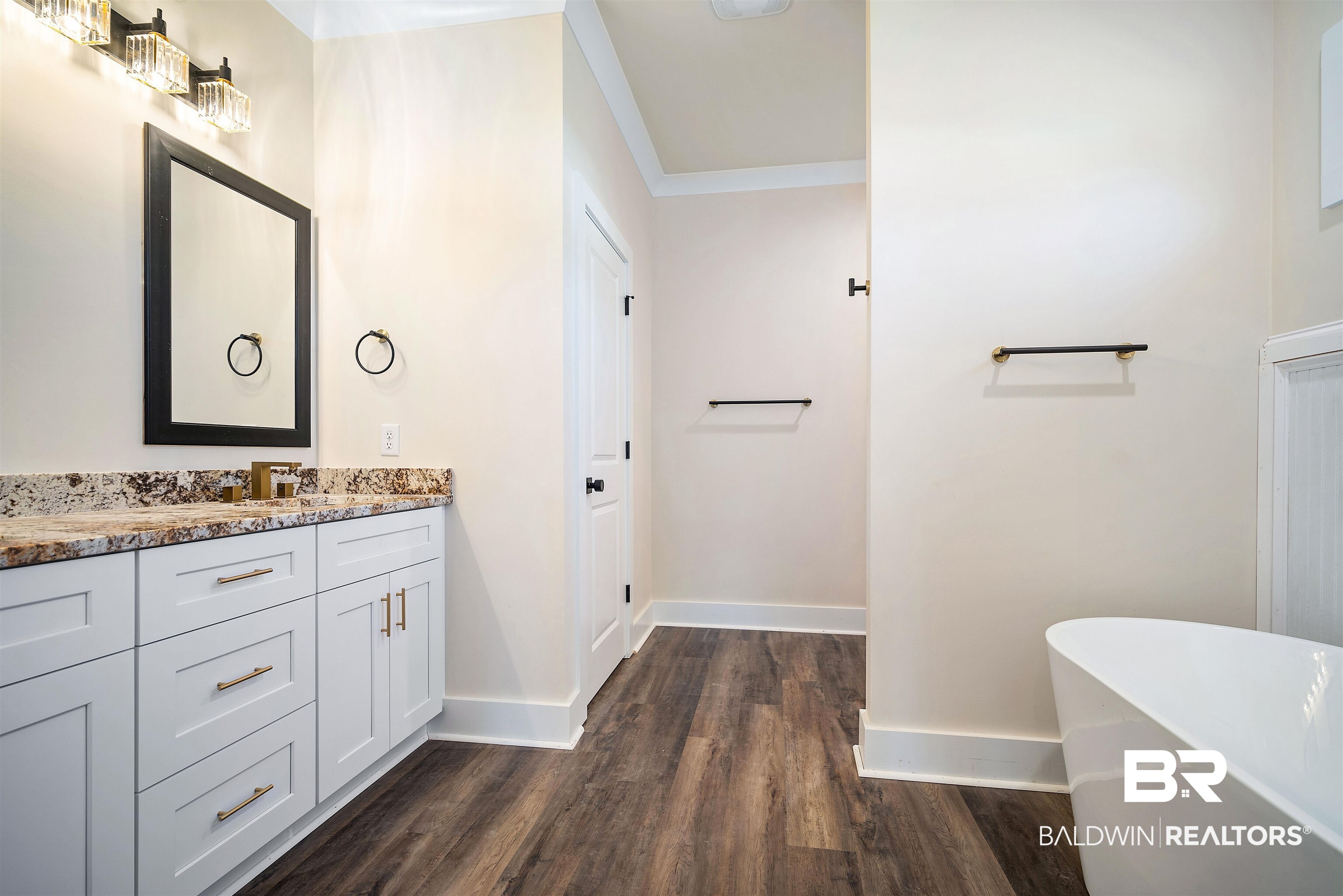 188 Hampton Ridge Mobile, AL 36608 - Photo 19 of 37 Primary bath featuring a double vanity with granite tops, freestanding soaking tub, 5' foot shower, and separate water closet.