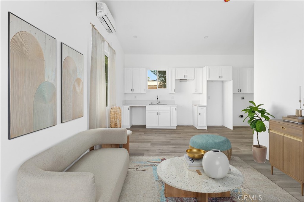 8510 1/2 Wilbur Avenue Northridge, CA 91324 - Photo 1 of 11 a living room with furniture and wooden floor
