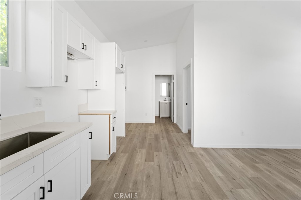 8510 1/2 Wilbur Avenue Northridge, CA 91324 - Photo 4 of 11 a view of a kitchen with wooden floor