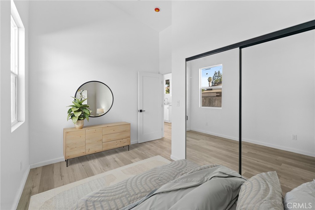 8510 1/2 Wilbur Avenue Northridge, CA 91324 - Photo 6 of 11 a bedroom with a bed and a mirror