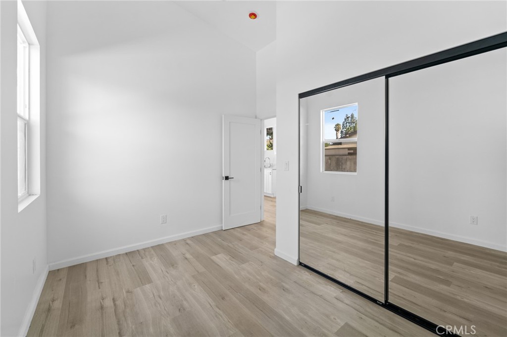 8510 1/2 Wilbur Avenue Northridge, CA 91324 - Photo 7 of 11 a view of an empty room with wooden floor