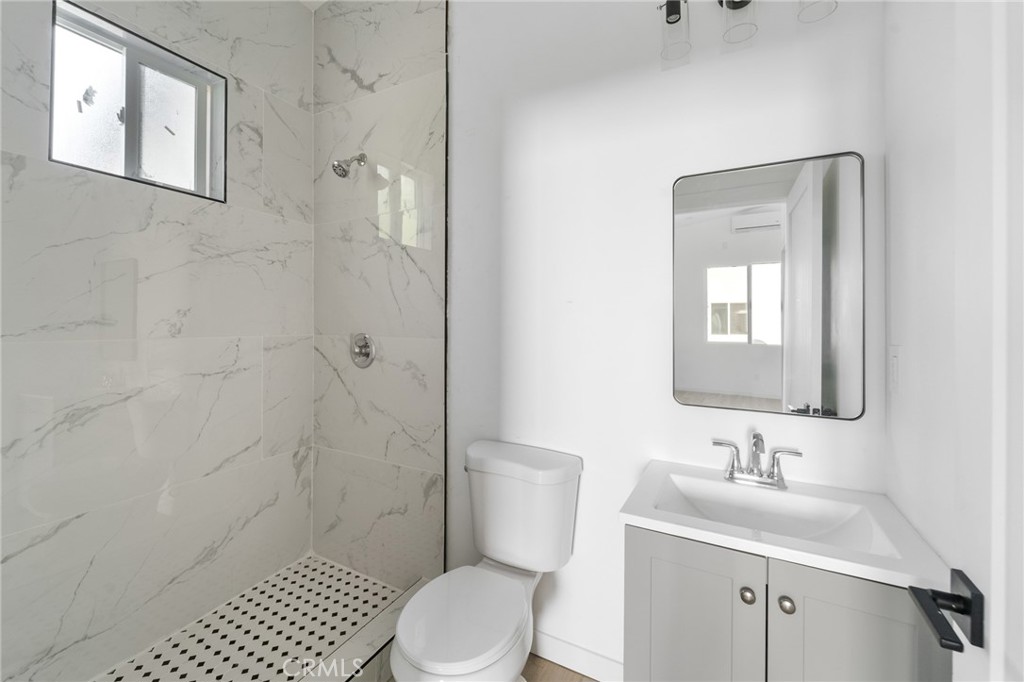 8510 1/2 Wilbur Avenue Northridge, CA 91324 - Photo 8 of 11 a bathroom with a sink toilet and shower