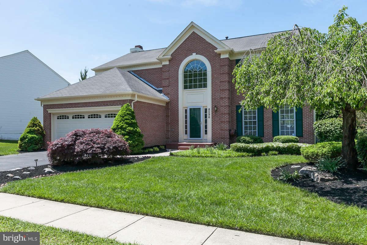 8596 Trail View Drive Ellicott City, MD 21043 - Photo 1 of 29 a front view of a house with a garden