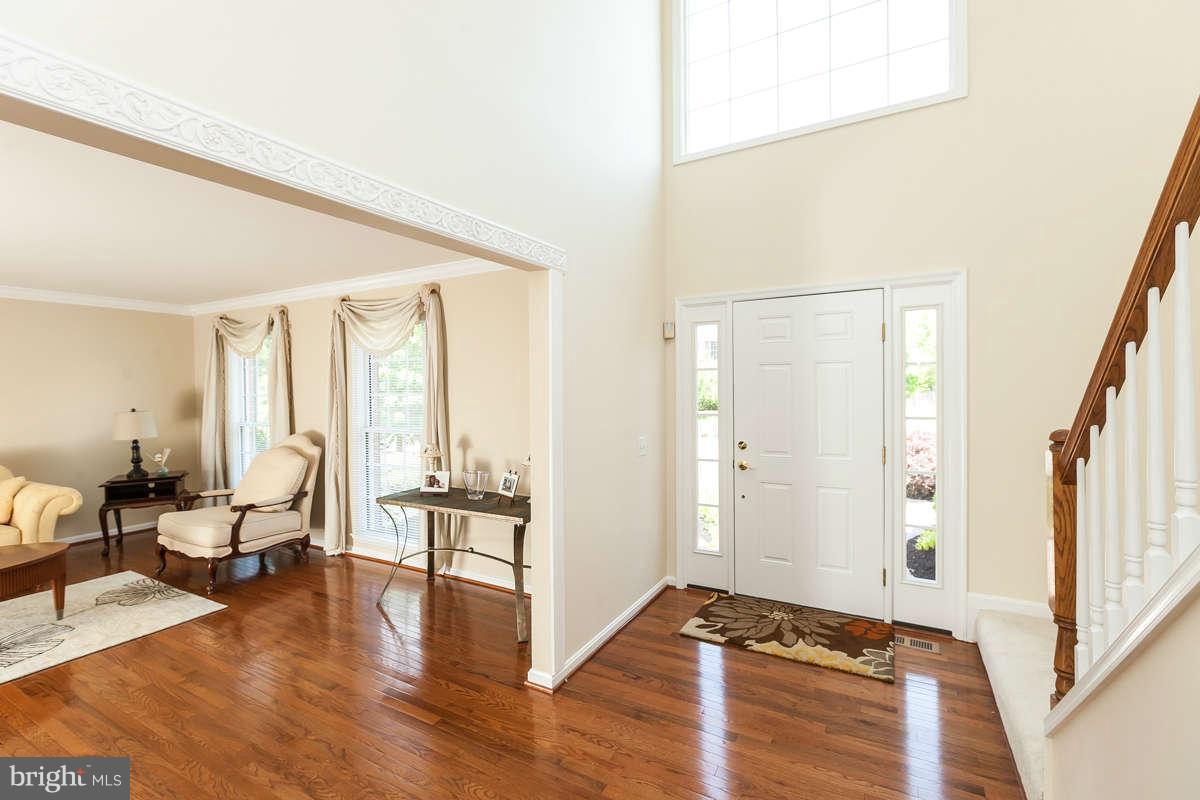 8596 Trail View Drive Ellicott City, MD 21043 - Photo 2 of 29 a view of room with furniture and wooden floor