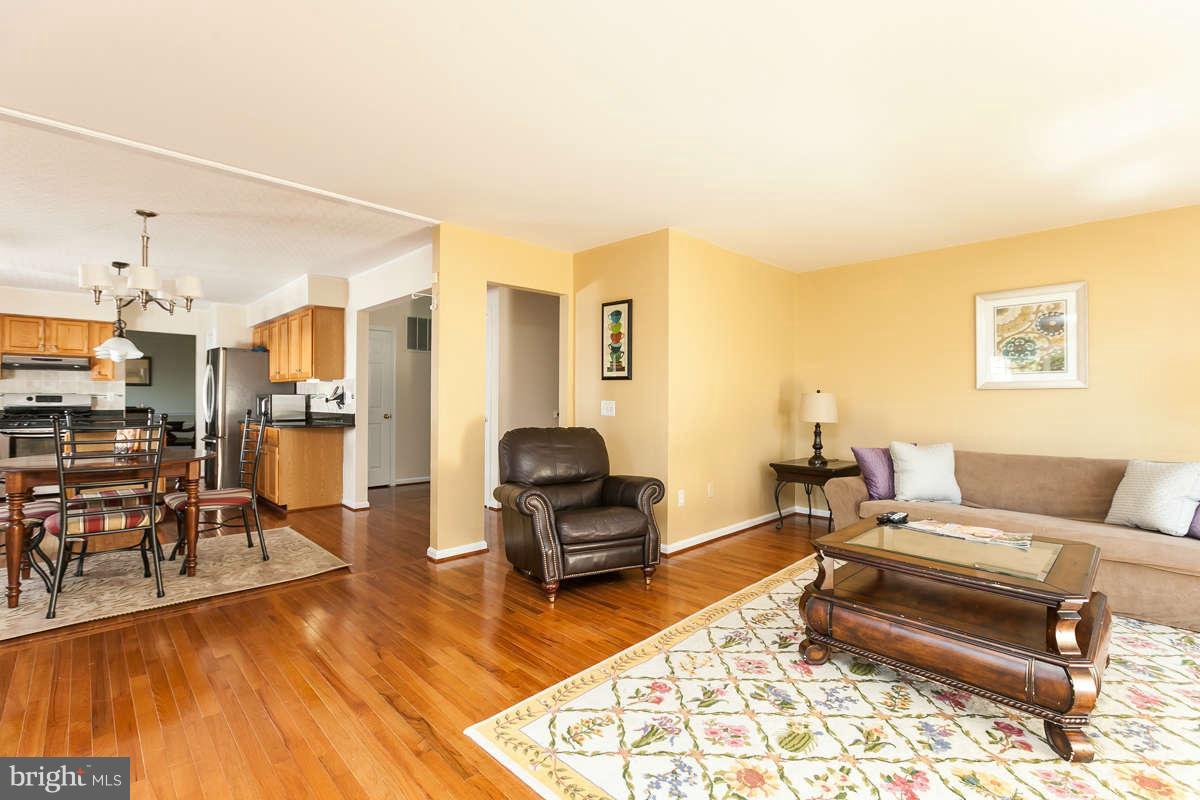8596 Trail View Drive Ellicott City, MD 21043 - Photo 11 of 29 a living room with furniture and a wooden floor