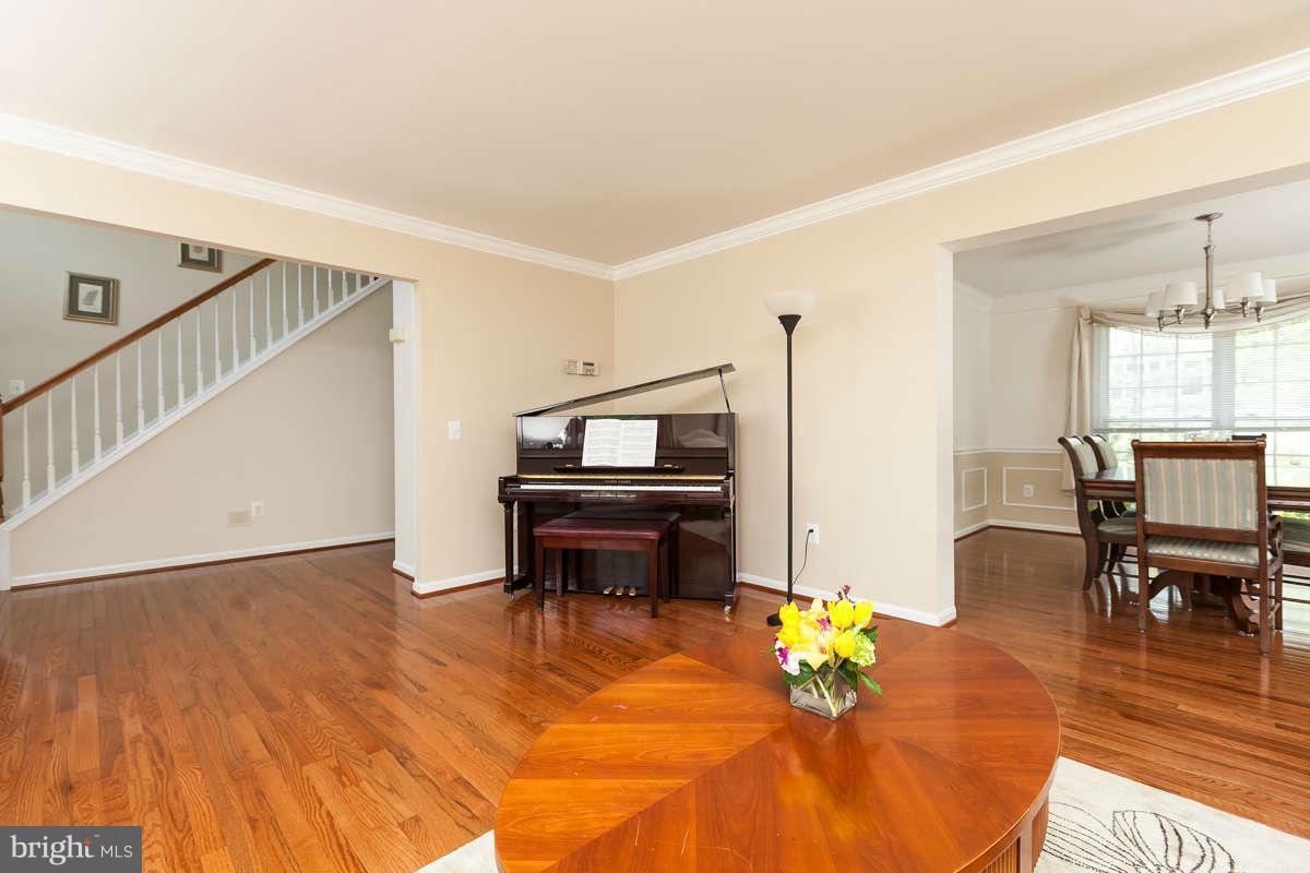 8596 Trail View Drive Ellicott City, MD 21043 - Photo 4 of 29 a living room with furniture and a wooden floor