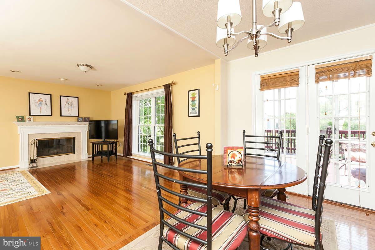8596 Trail View Drive Ellicott City, MD 21043 - Photo 9 of 29 a view of a dining room with furniture window and wooden floor