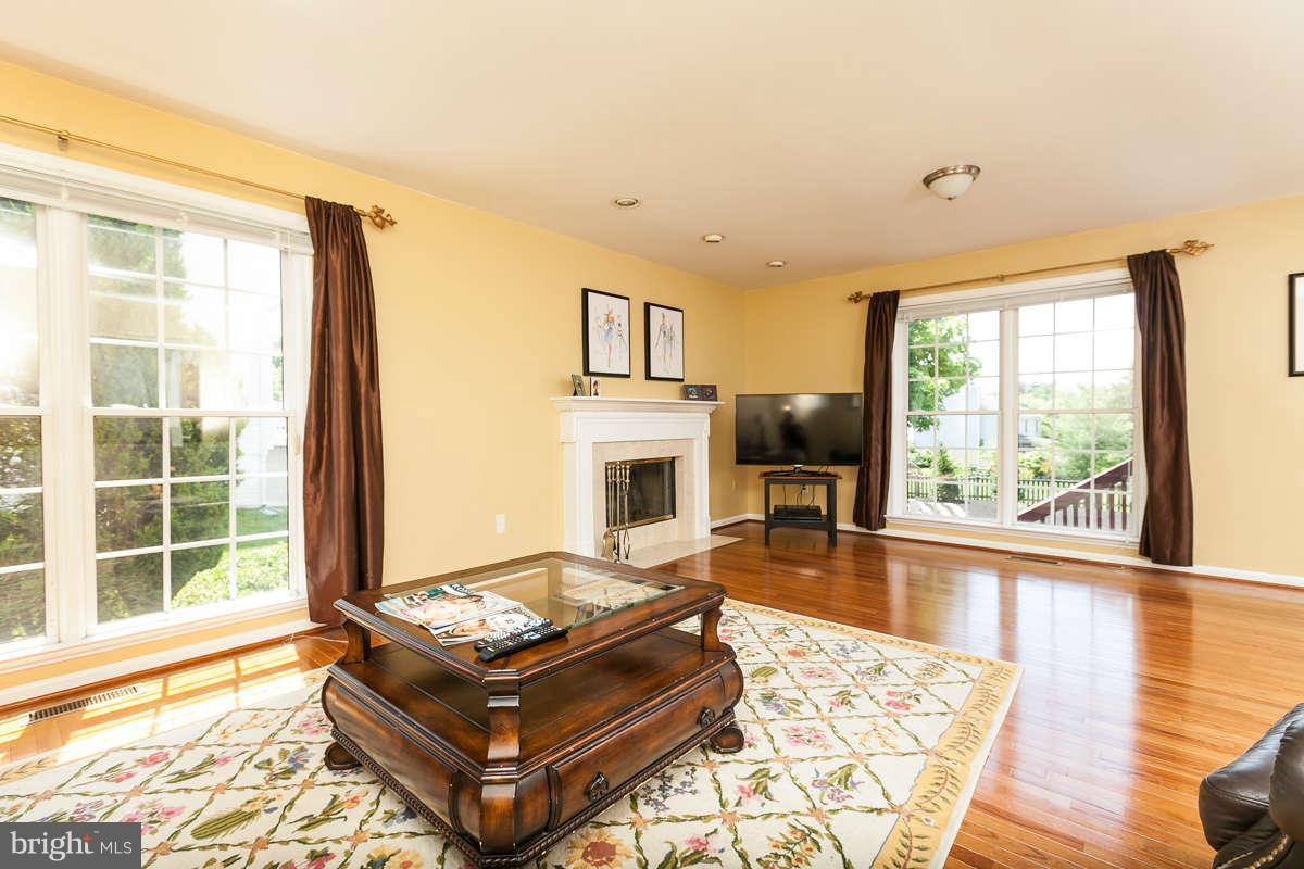 8596 Trail View Drive Ellicott City, MD 21043 - Photo 10 of 29 a living room with furniture large window and flat screen tv