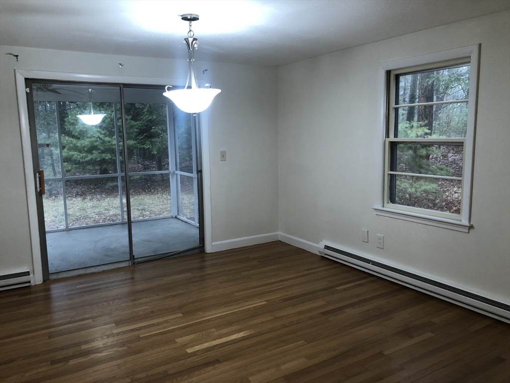 53 Deerhaven Road, Unit 1 Lincoln, MA 01773 - Photo 11 of 42 a view of a room with wooden floor and window
