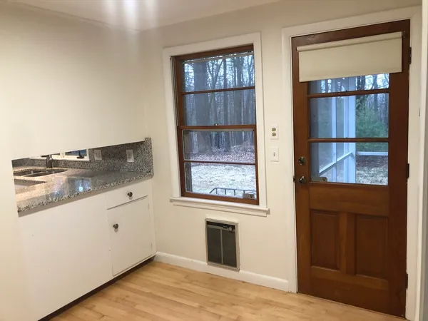 a kitchen with a stove and a refrigerator