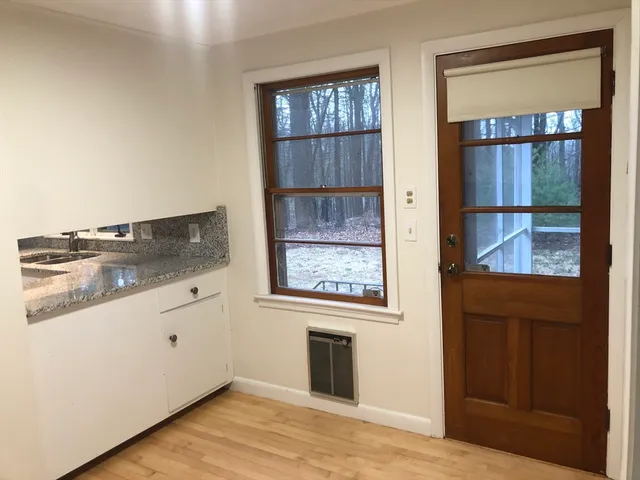a kitchen with a stove and a refrigerator