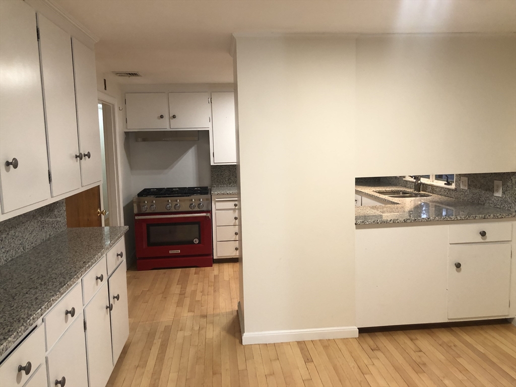 53 Deerhaven Road, Unit 1 Lincoln, MA 01773 - Photo 19 of 42 a kitchen with a stove and a refrigerator