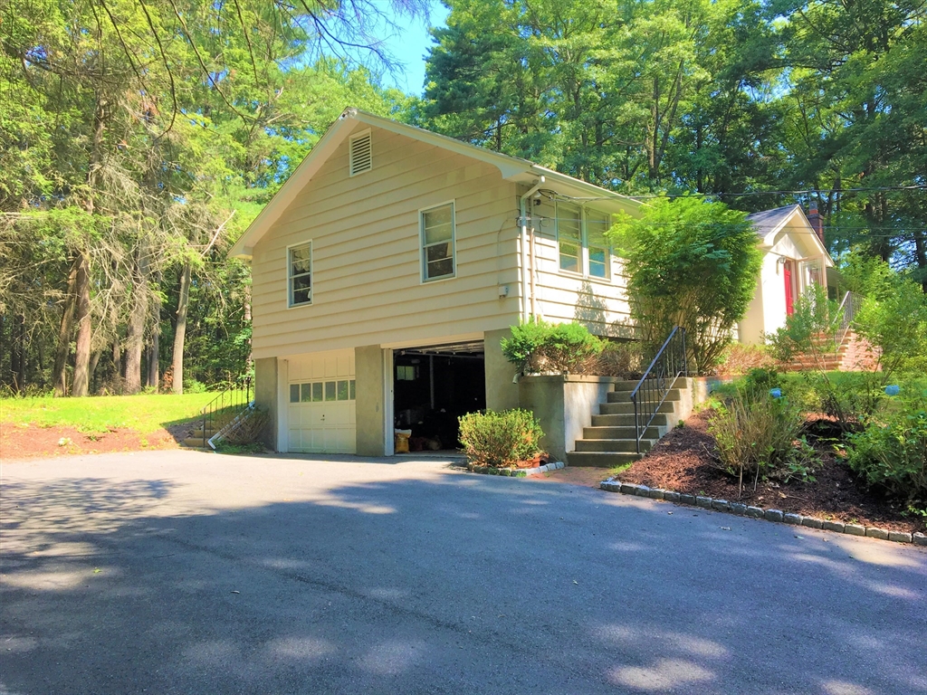 53 Deerhaven Road, Unit 1 Lincoln, MA 01773 - Photo 2 of 42 a view of a house with backyard and garden