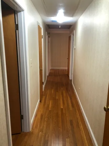 a bathroom with a sink toilet and window