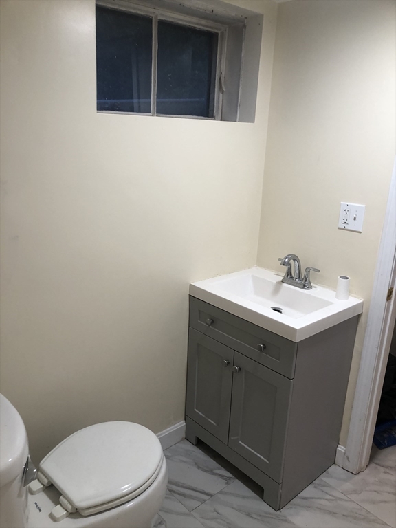 53 Deerhaven Road, Unit 1 Lincoln, MA 01773 - Photo 41 of 42 a bathroom with a sink and a toilet