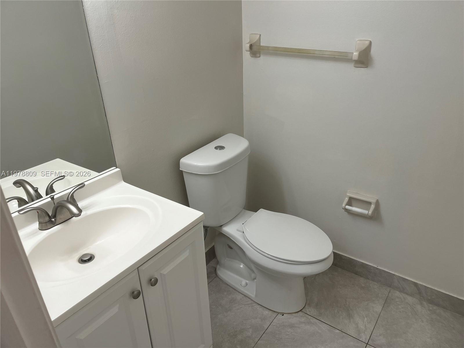 1250 Lincoln Road, Unit 310 Miami Beach, FL 33139 - Photo 16 of 27 a white toilet sitting next to a white sink