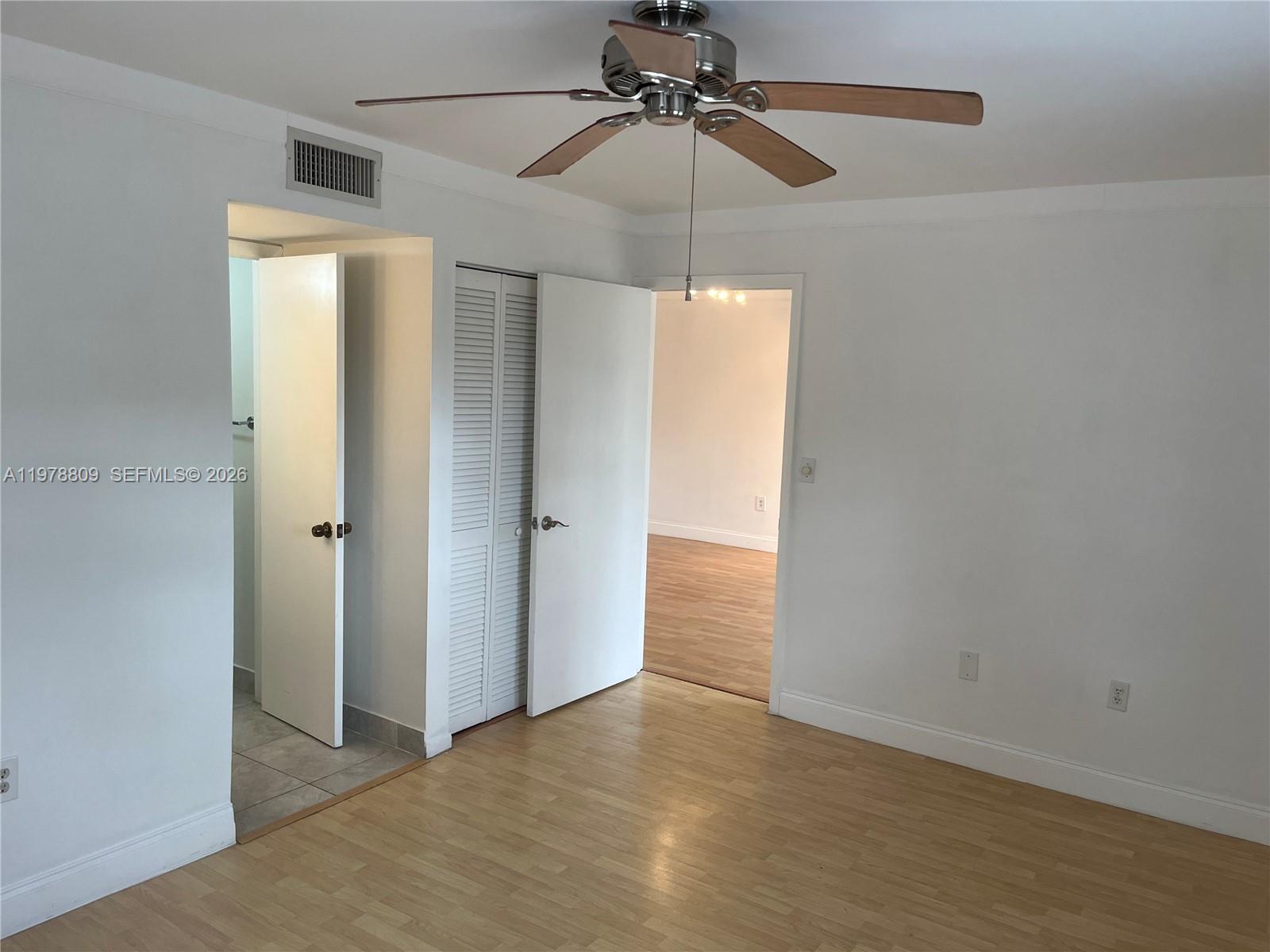 1250 Lincoln Road, Unit 310 Miami Beach, FL 33139 - Photo 18 of 27 a view of empty room with a fan and window